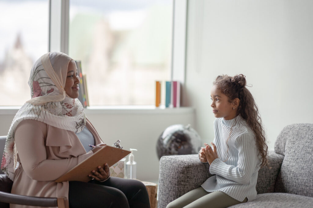 image of a therapy of color with a child in therapy